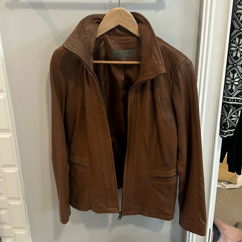 Almost new.  Barely worn.  Beautiful leather lamb jacket.  No stains.